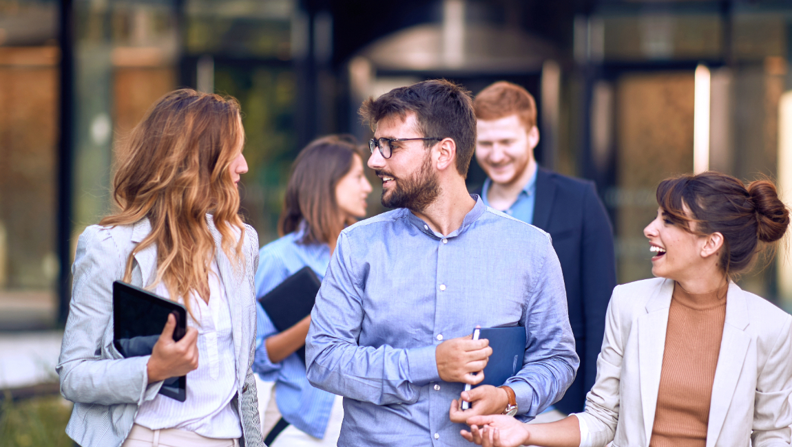 Group of colleagues talking casually outside