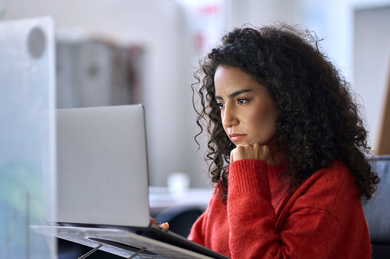 Woman studying a laptop screen