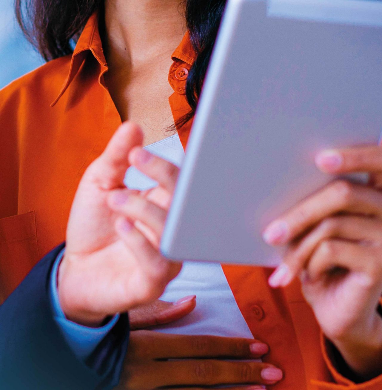 Continuation of mosaic image of two colleagues smiling and looking at tablet
