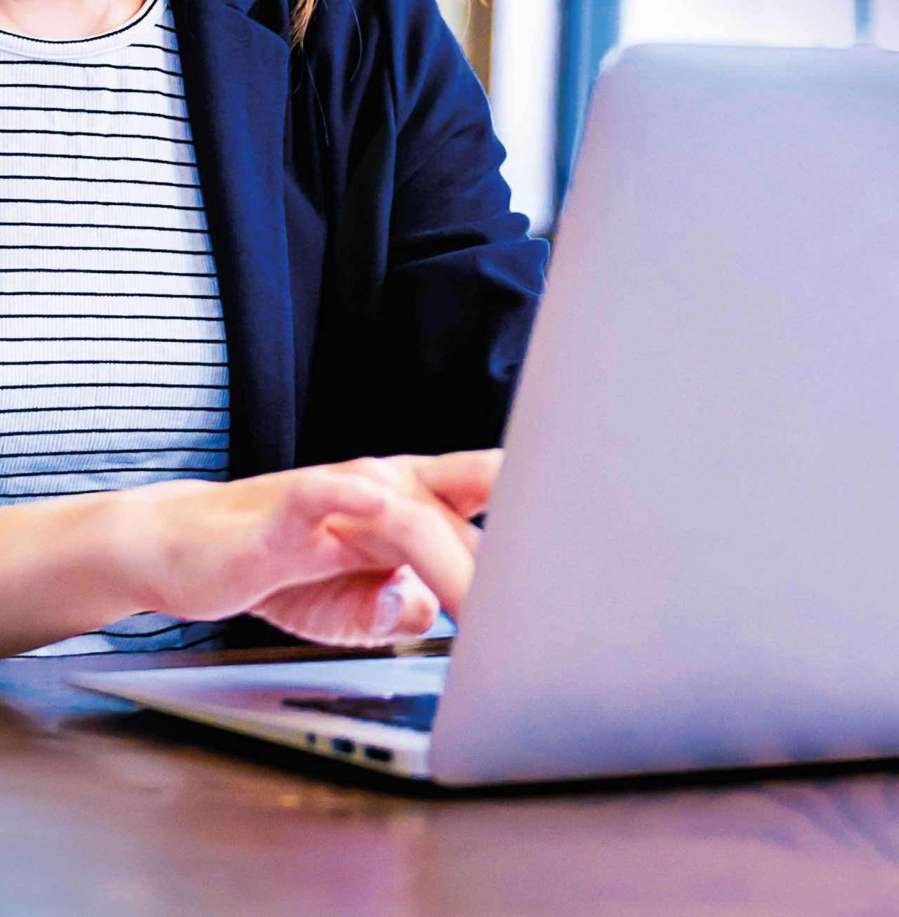 Continuation of image mosaic of smiling woman working on laptop